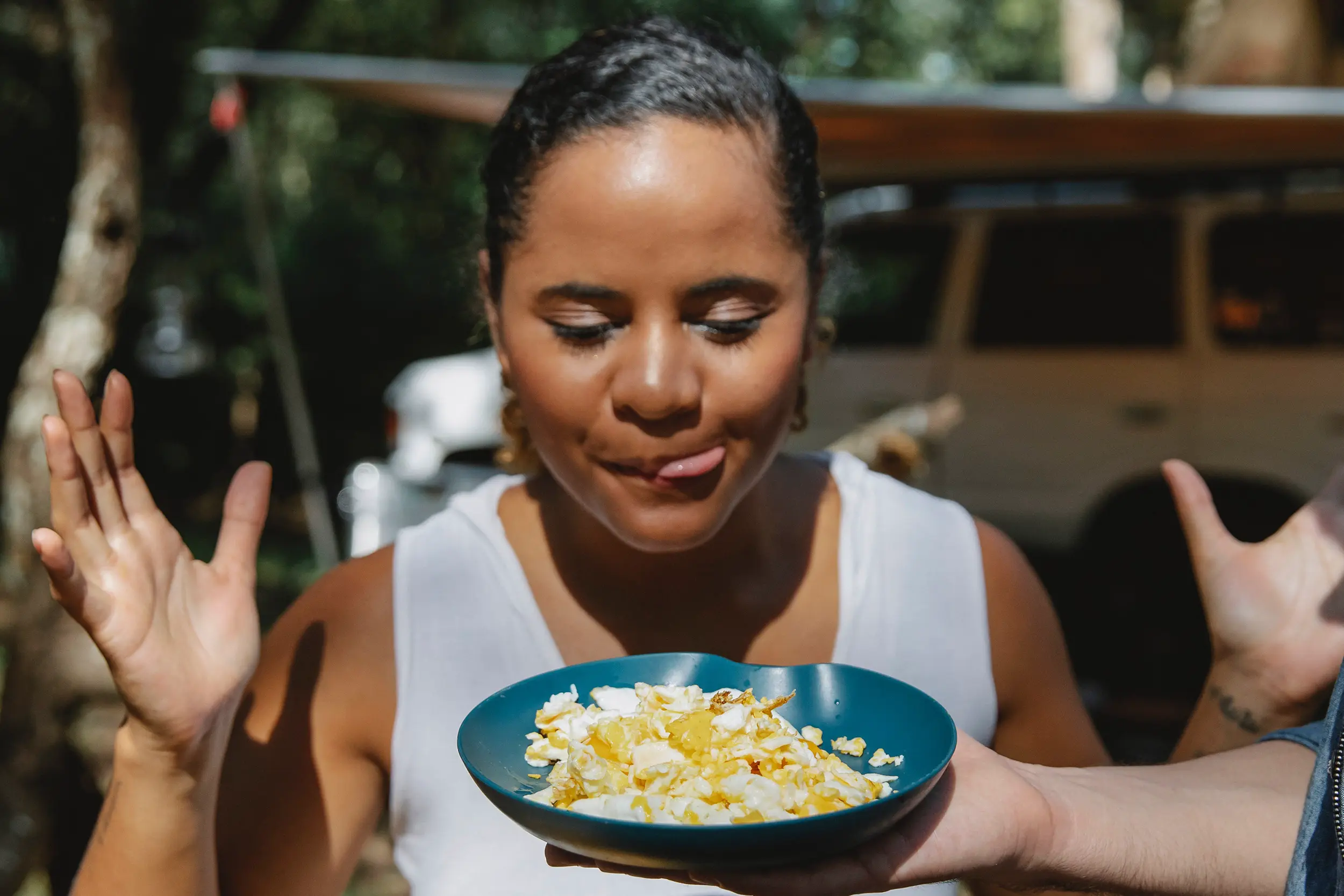 Woman looking at delicious bowl of food