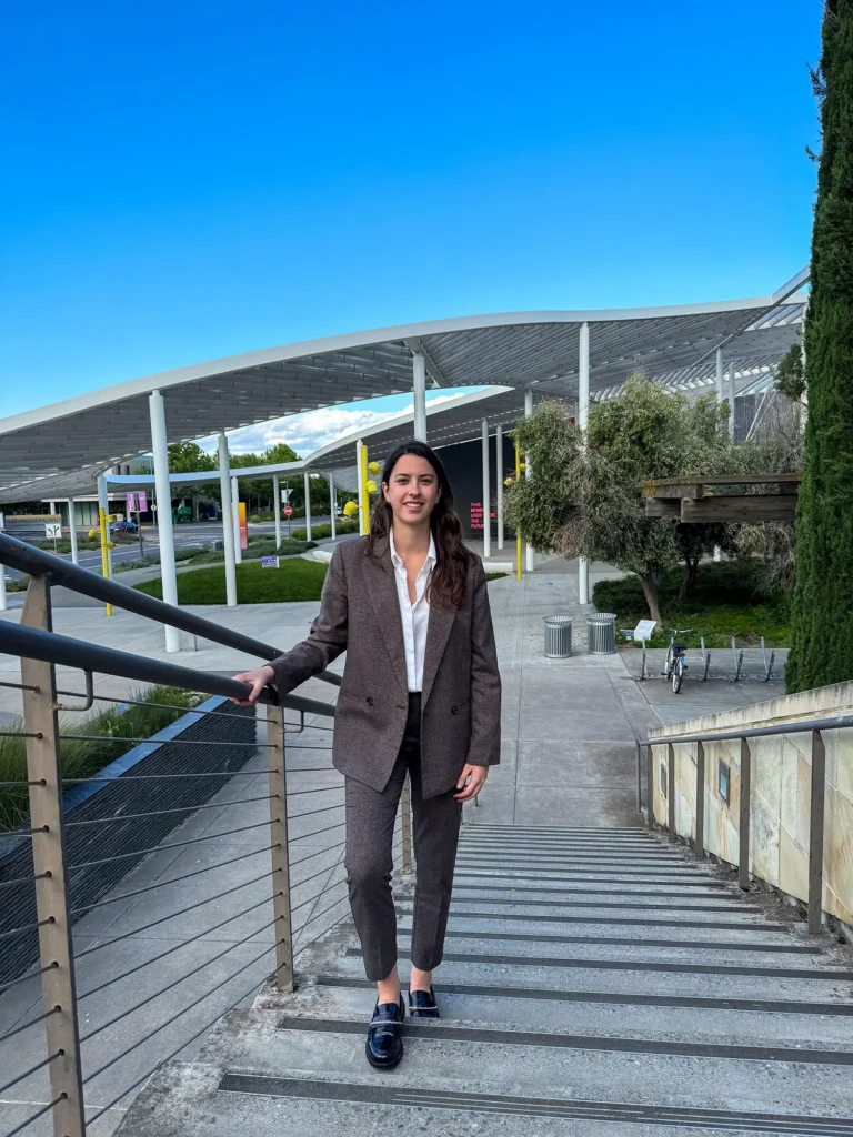 Woman standing on steps outside of a building