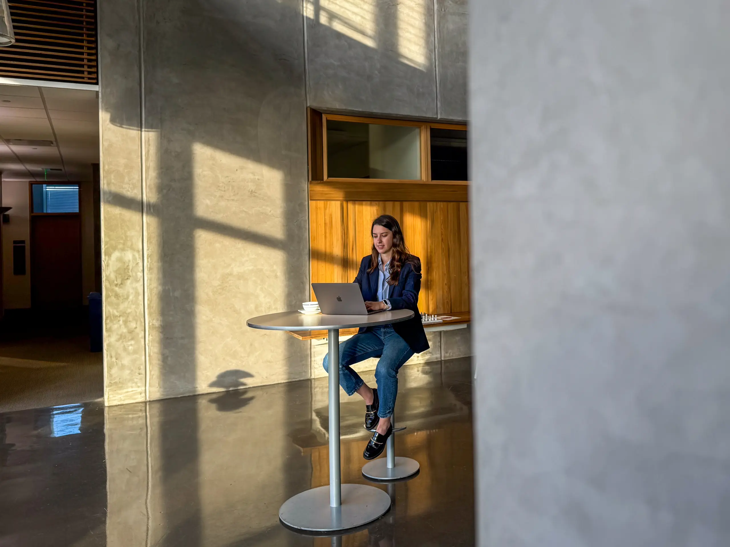 Woman sitting at a table on computer