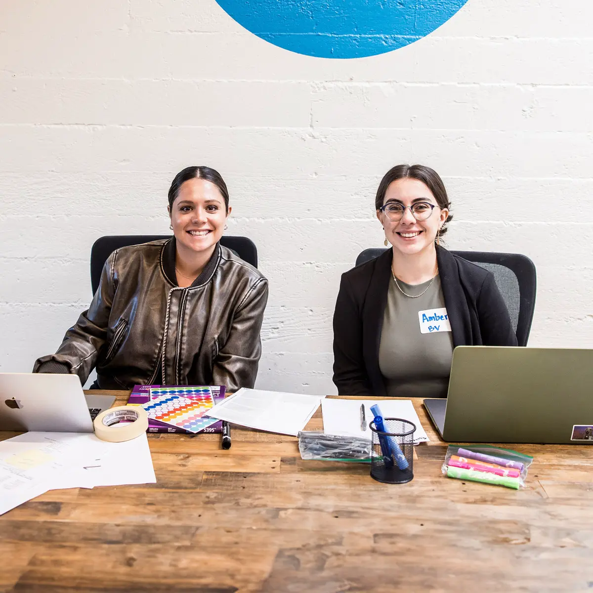 Two women sitting at a table working