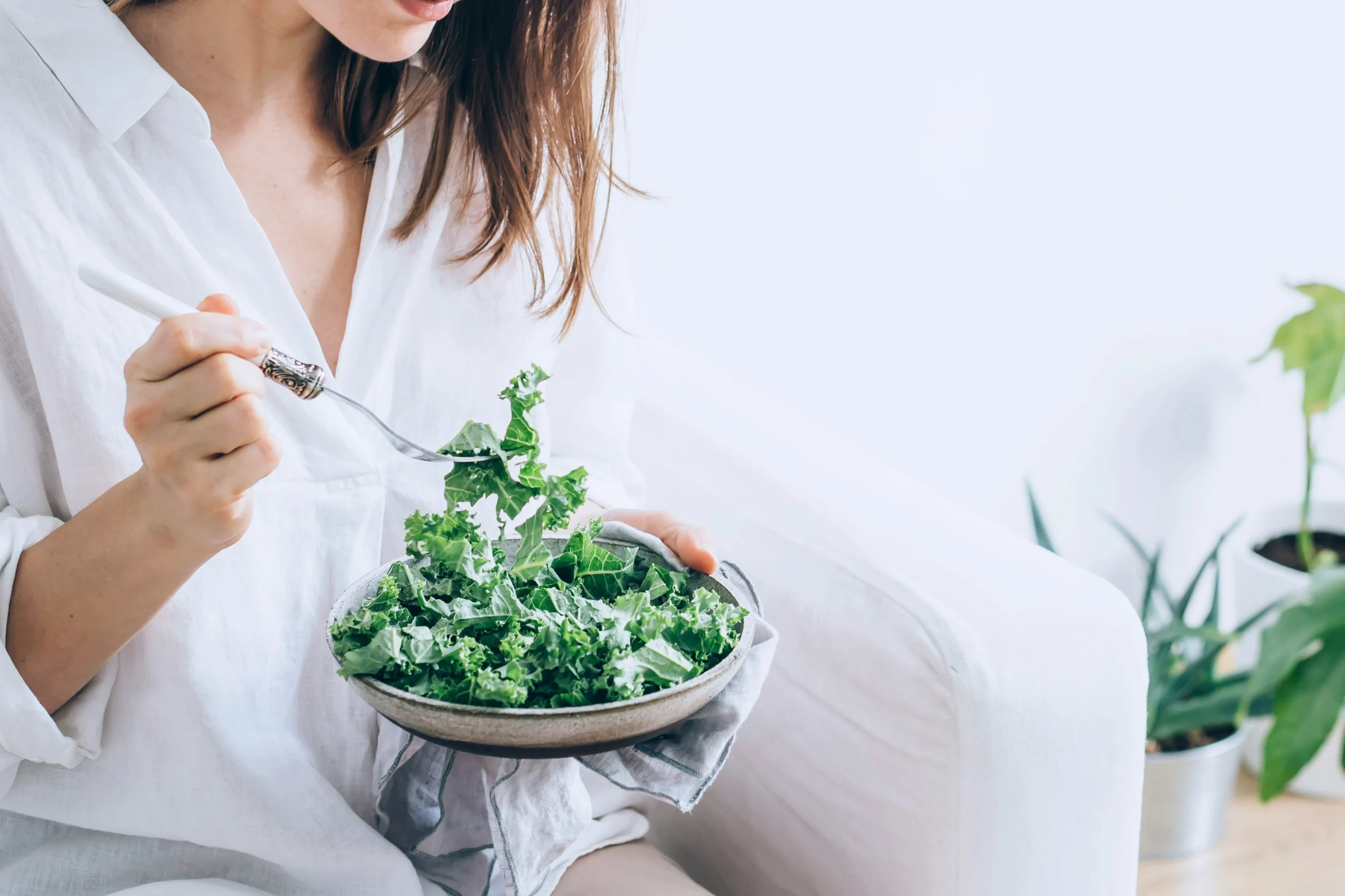 Woman eating salad