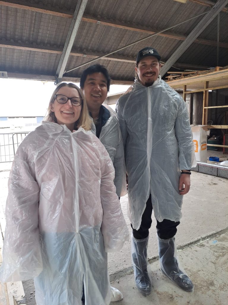 three fellows in white plastic covers