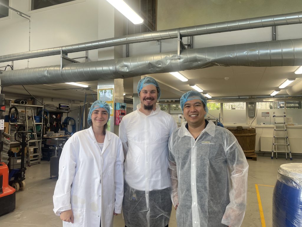 three fellows at bioprocessing facility