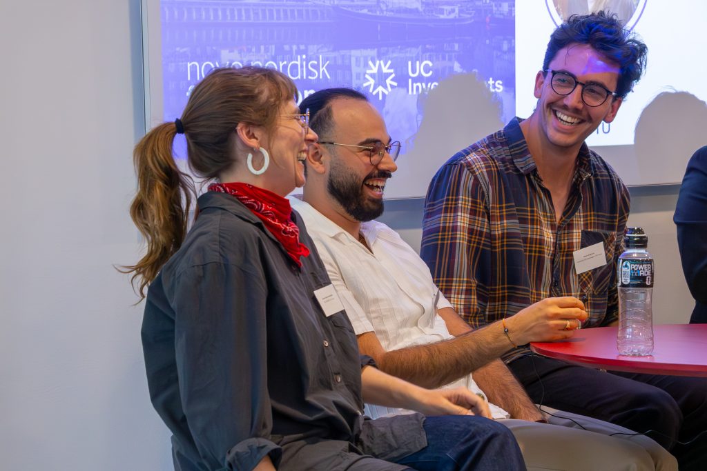 Three Denmark fellows laughing