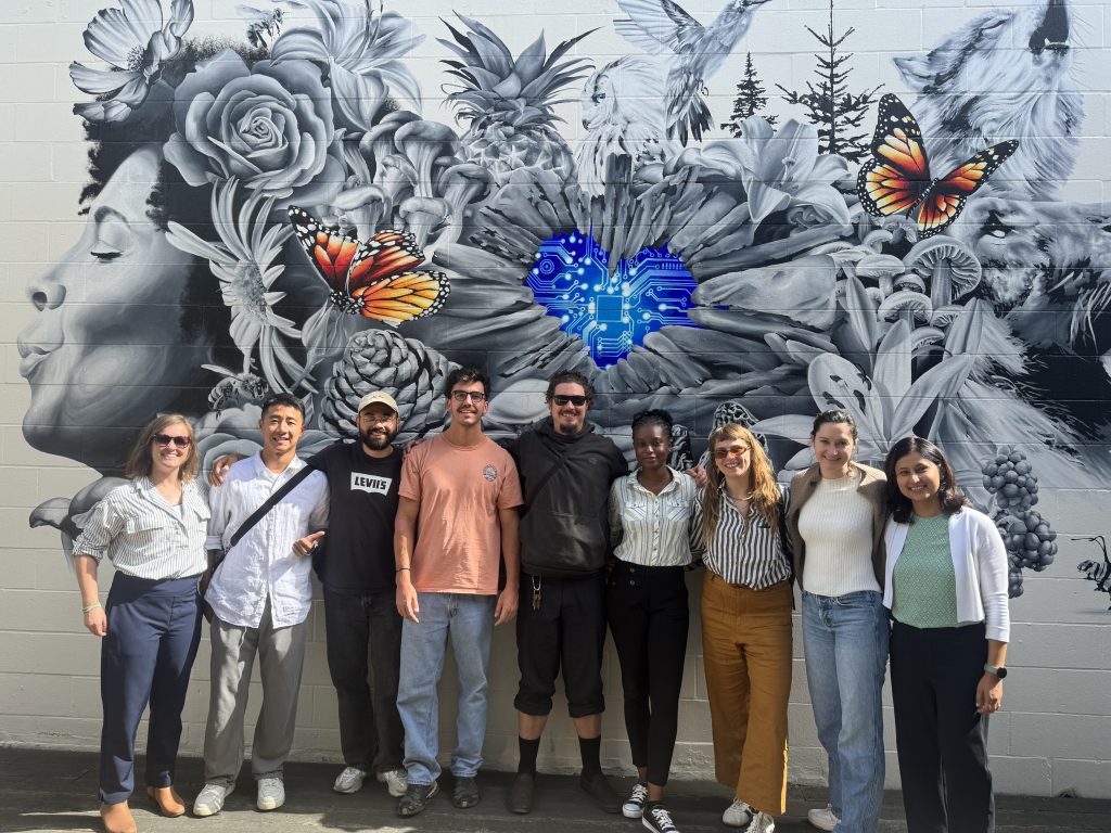 Group of fellows in front of MISTA San Francisco Mural