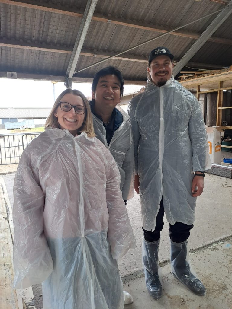 Innovator fellows Tana, Ian and Lik in white coats
